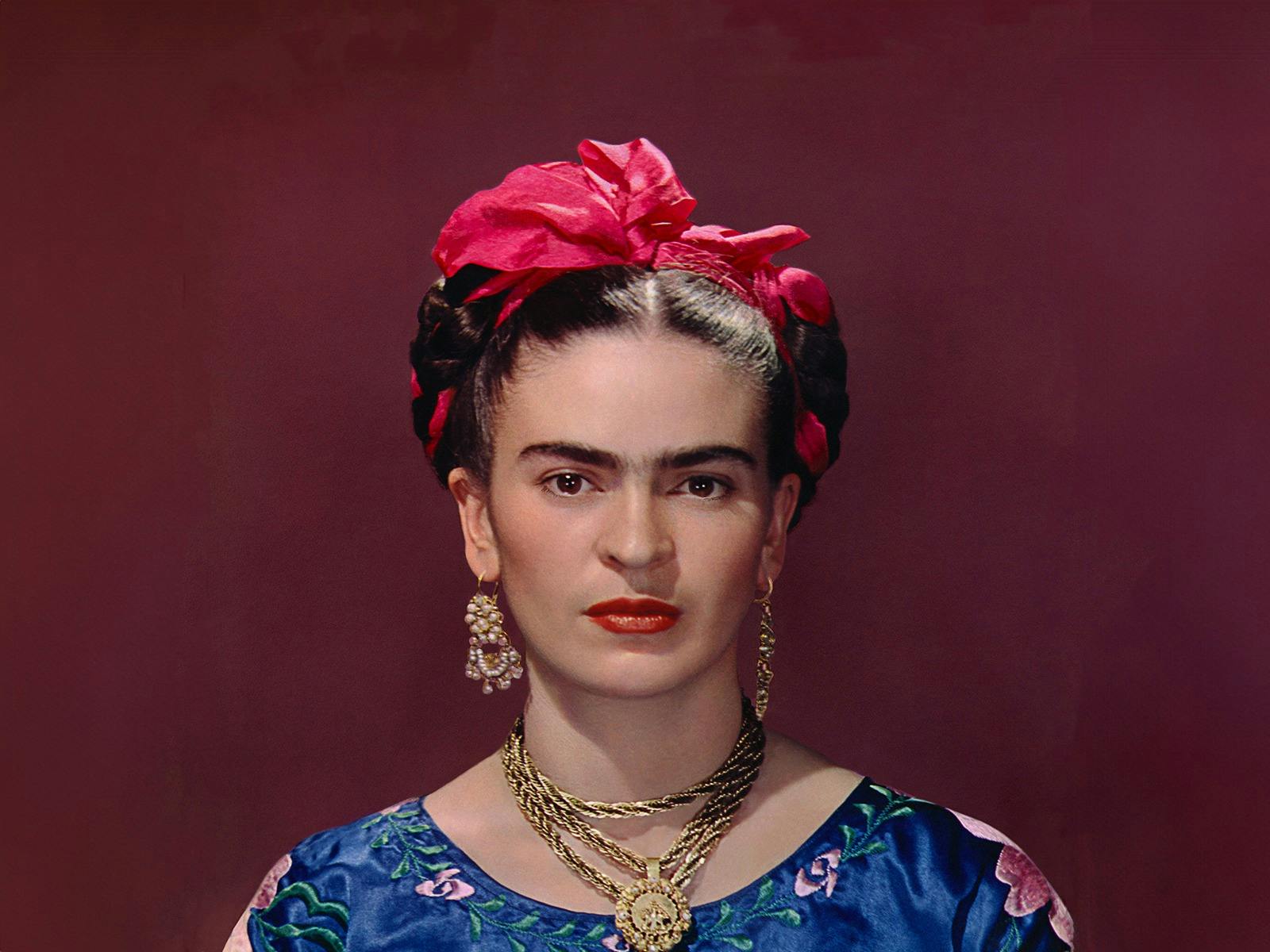 Frida Kahlo in blue satin blouse, 1939, photograph by Nickolas Muray © Nickolas Muray Photo Archives