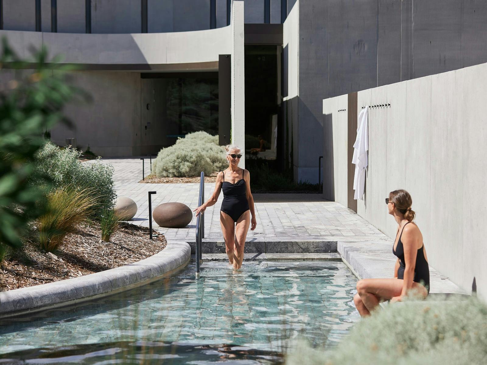 Two women bathing in geo thermal pool
