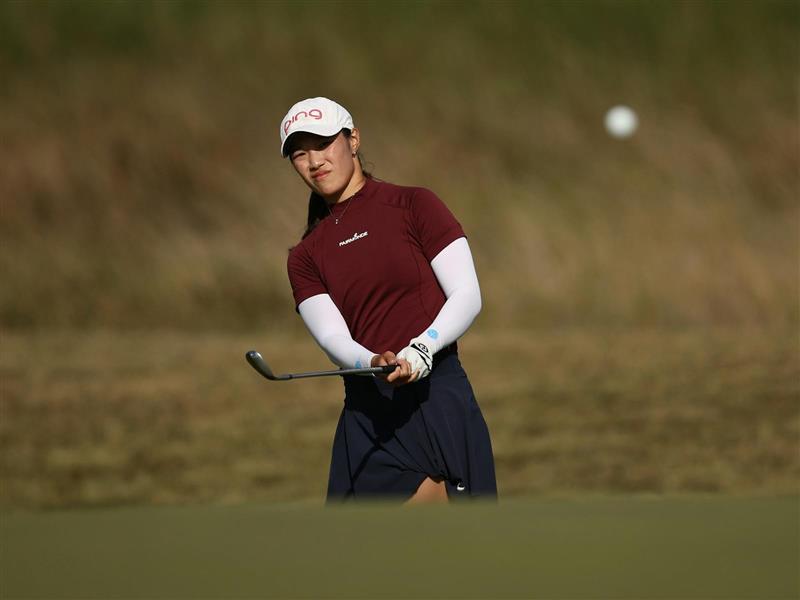 Ashley Lau watching the ball