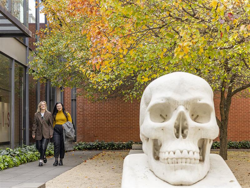 Two people exiting Bendigo Art Gallery, Goldfields, Victoria.